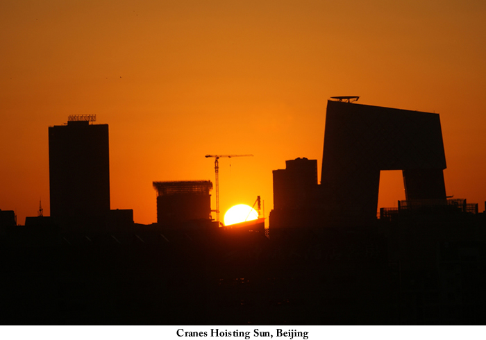 cranes_hoisting_sun_Beijing